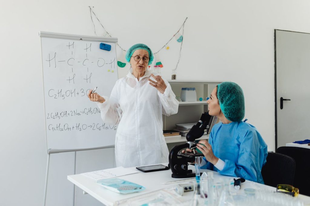 Laboratory quality control team reviewing supplement manufacturing records and batch documentation