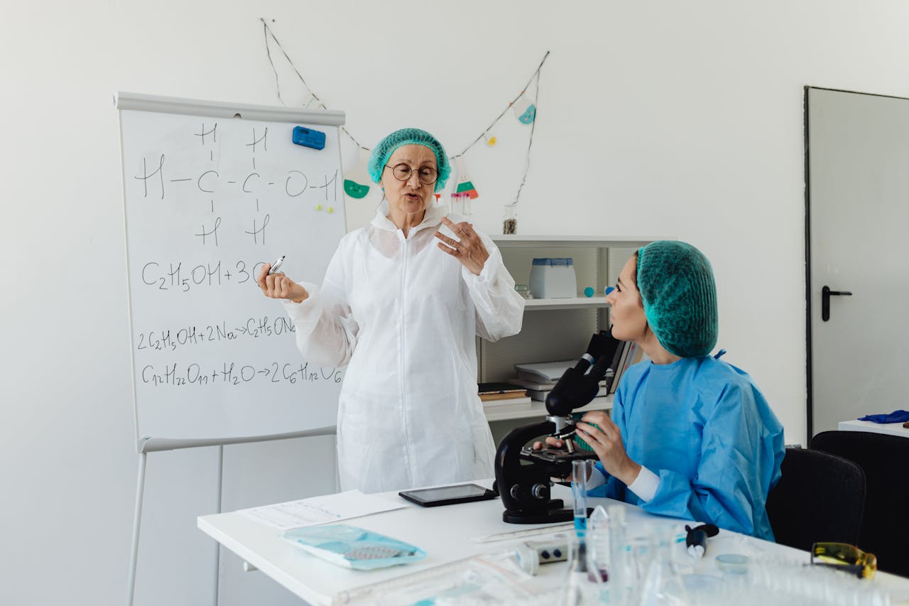 Laboratory quality control team reviewing supplement manufacturing records and batch documentation